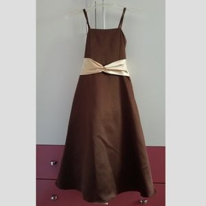 Elegant brown dress with yellow sash